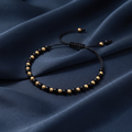 Onyx & Gold Bead Cord Bracelet